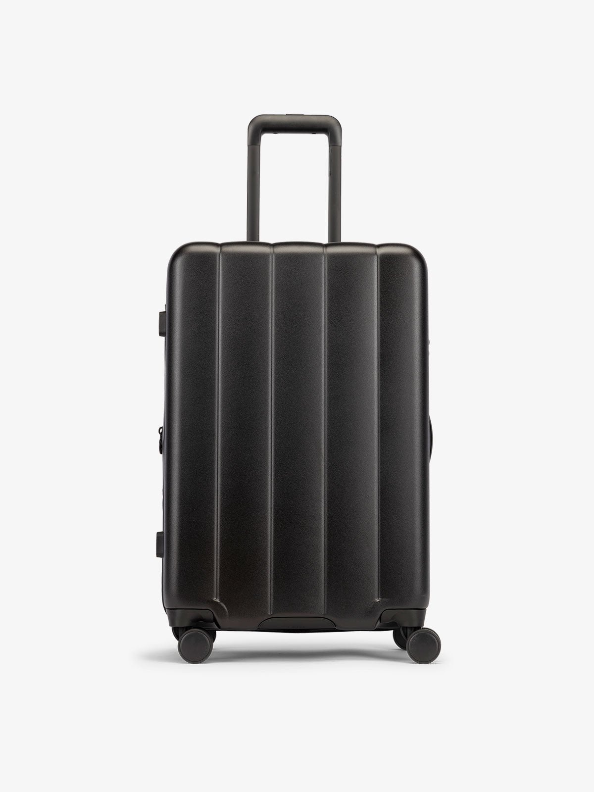 Black medium luggage made from an ultra-durable polycarbonate shell and expandable by up to 2"