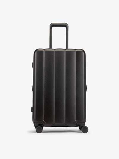 CALPAK Black medium luggage made from an ultra-durable polycarbonate shell and expandable by up to 2