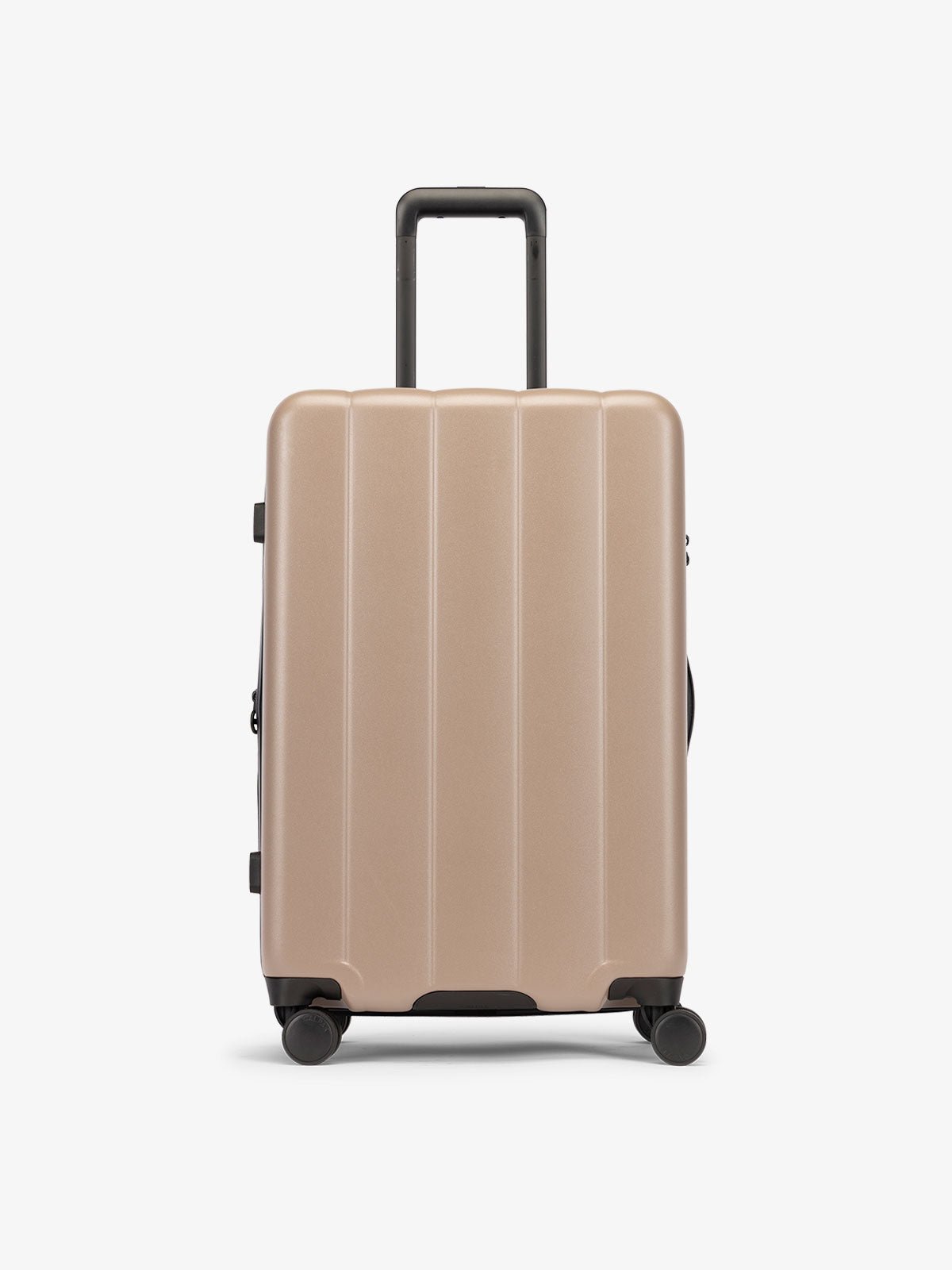 Brown chocolate medium luggage made from an ultra-durable polycarbonate shell and expandable by up to 2"