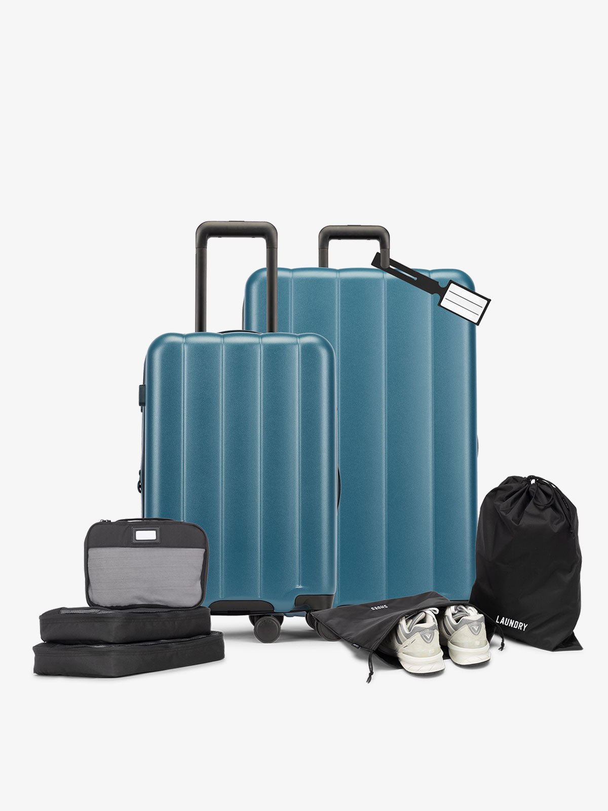 CALPAK starter bundle with carry-on, large luggage, packing cubes, pouches, and luggage tag