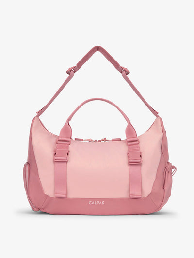 Front view of CALPAK Fit gym duffel bag made with recycled, water resistant material in tea rose; TBF2401-TEA-ROSE, TBF2401-TEA-ROSE-GRIN, BTBF2401-TEA-ROSE view 1