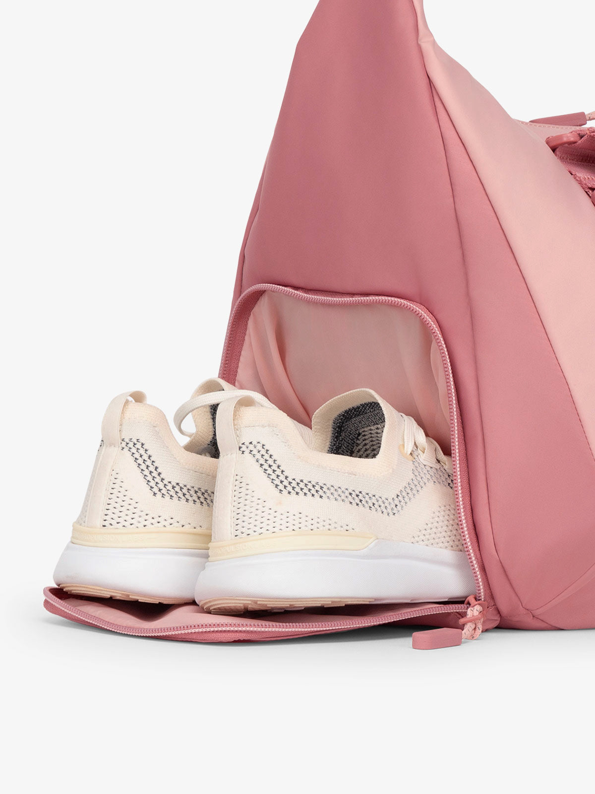 CALPAK Fit sling gym bag with separate shoe compartment in tea rose; TBF2401-TEA-ROSE, TBF2401-TEA-ROSE-GRIN, BTBF2401-TEA-ROSE