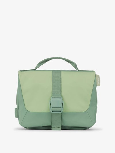 Front view of CALPAK Fit Hanging Dopp Kit made of recycled polyester and features a buckle front closure in sage; TFH2401-SAGE, TFH2401-SAGE-GRIN