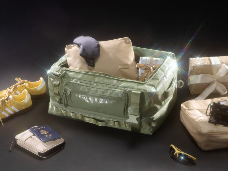 CALPAK Terra Large 50L Duffel Backpack filled with festive holiday gifts