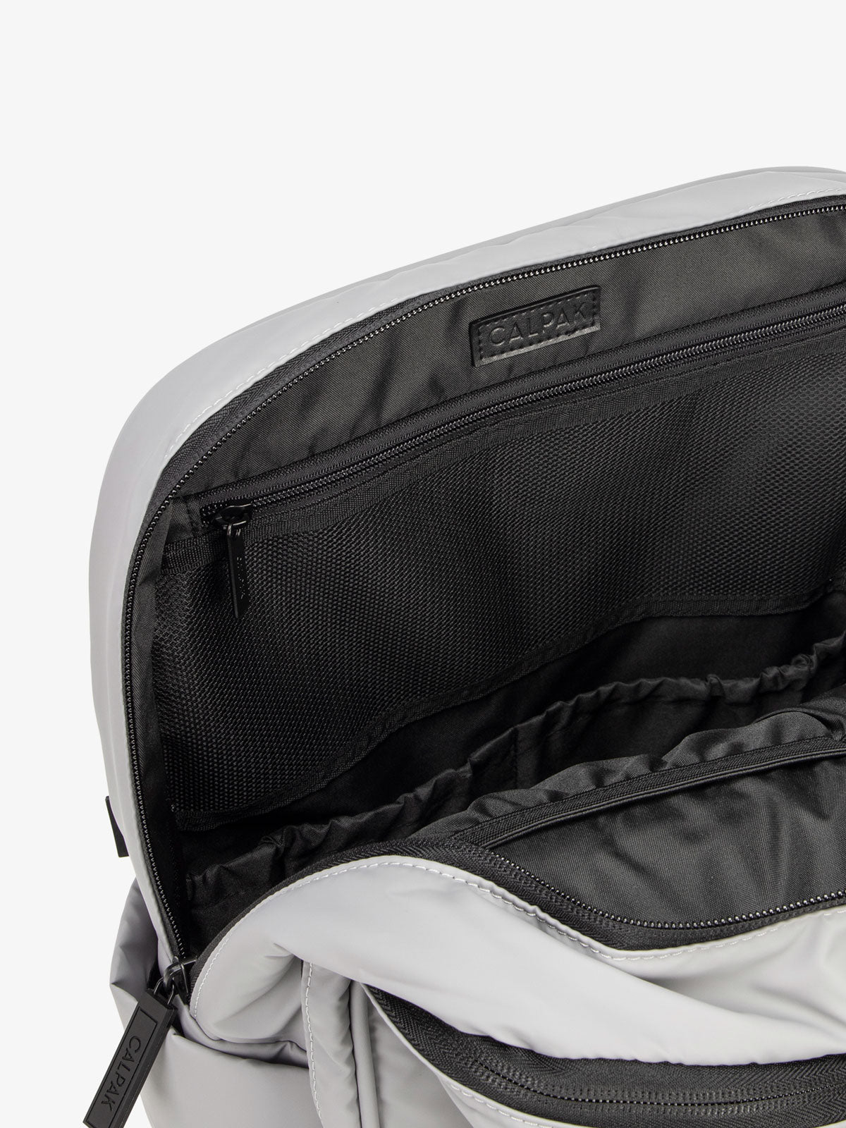 interior of grey CALPAK Luka laptop backpack with laptop sleeve; BPL2001-IRON