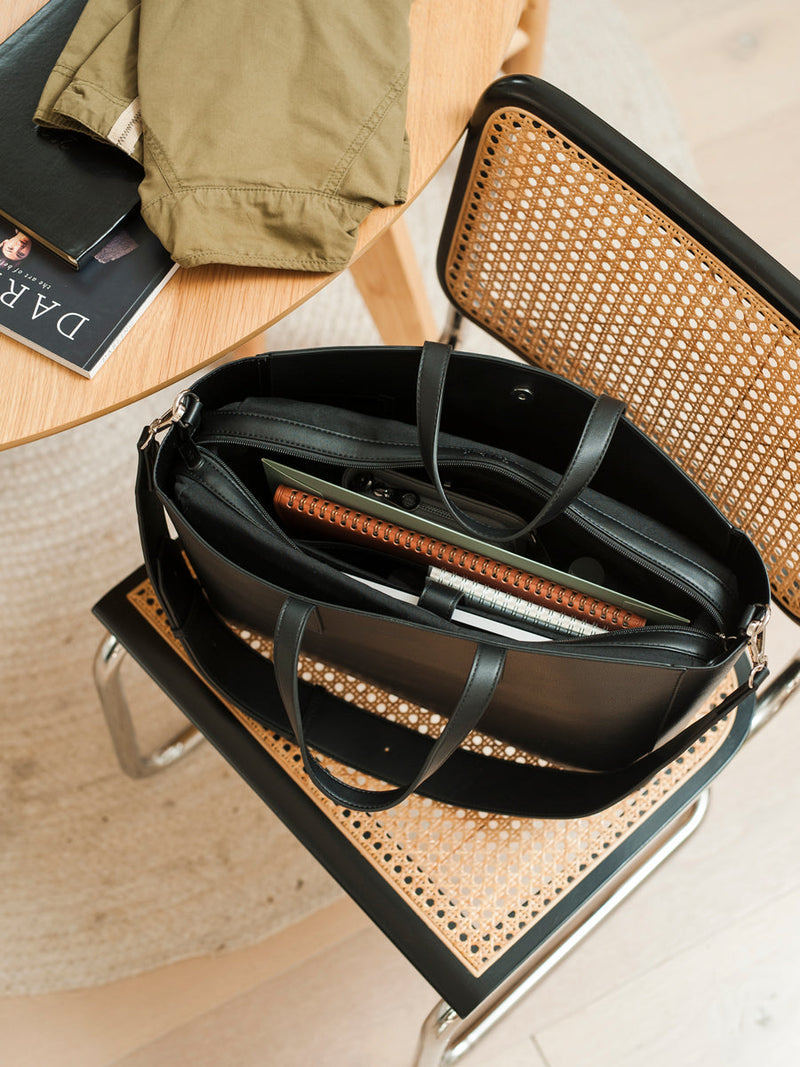 Black CALPAK Haven Laptop Tote with notebooks within