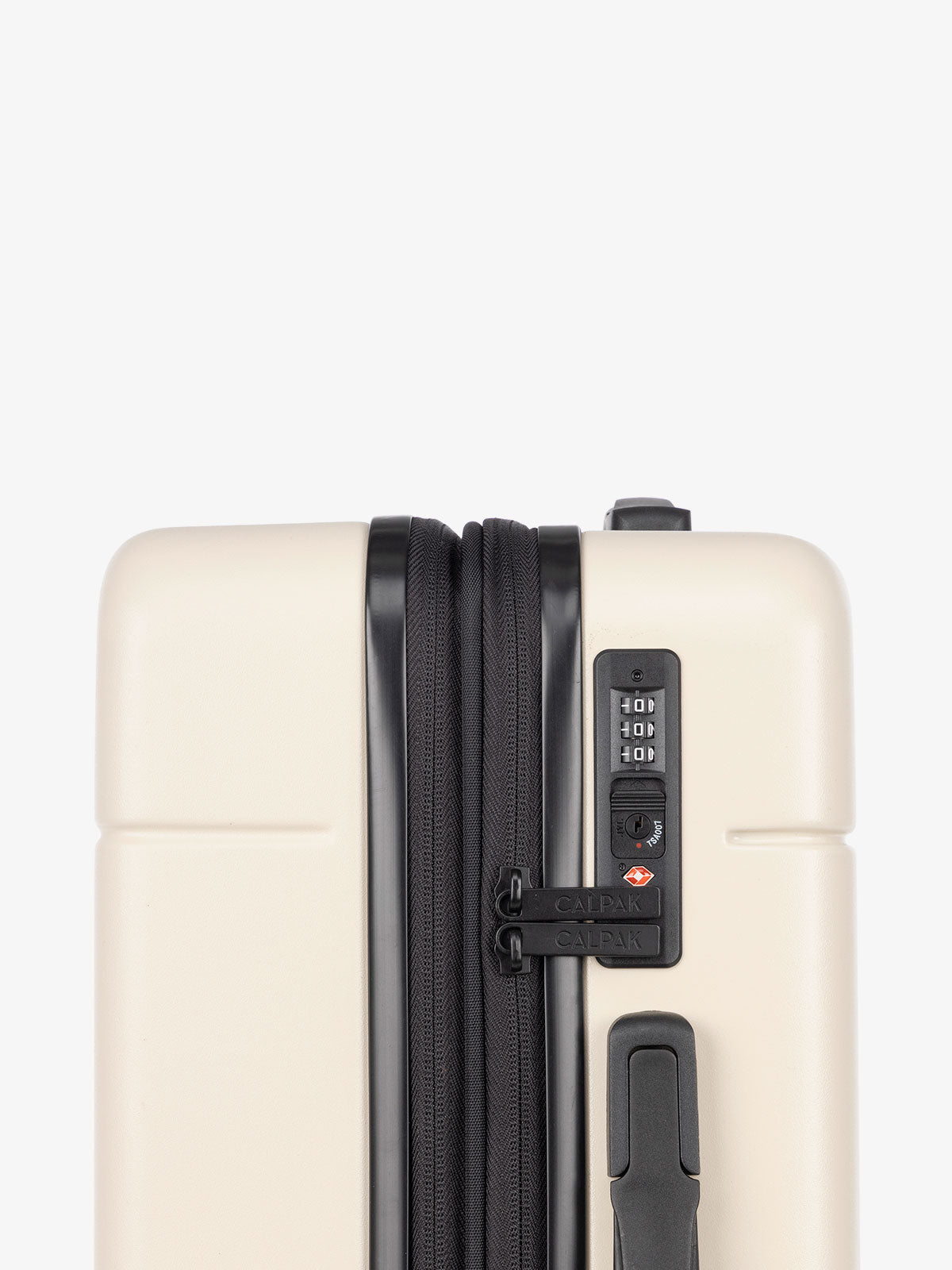 TSA lock of CALPAK Hue hard side carry-on luggage with spinner wheels in linen cream; LHU1020-NP-LINEN
