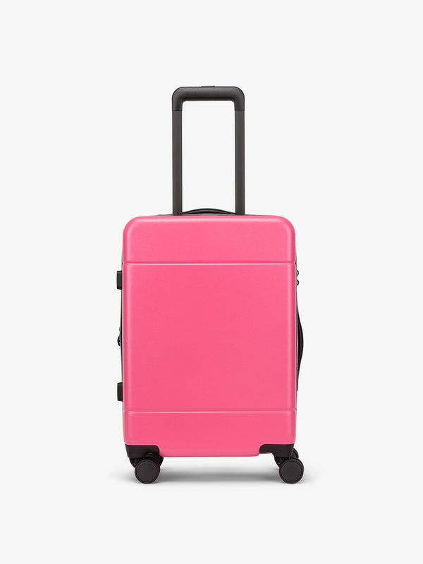 Hue hard shell rolling carry on luggage in hot pink dragonfruit
