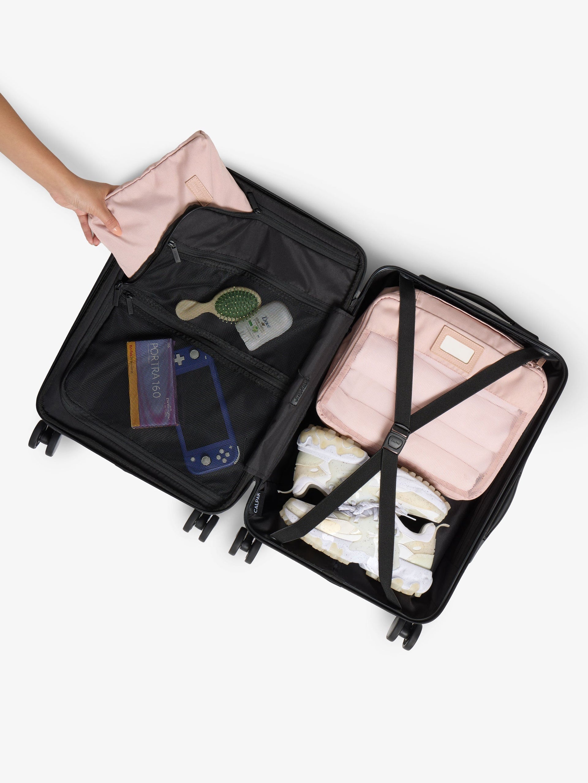 Interior of CALPAK Hue Carry-On Luggage with packing cubes and belongings inside; LHU1020-NP-BLACK