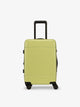 CALPAK Hue hard shell rolling carry on luggage in key lime; LHU1020-NP-KEY-LIME