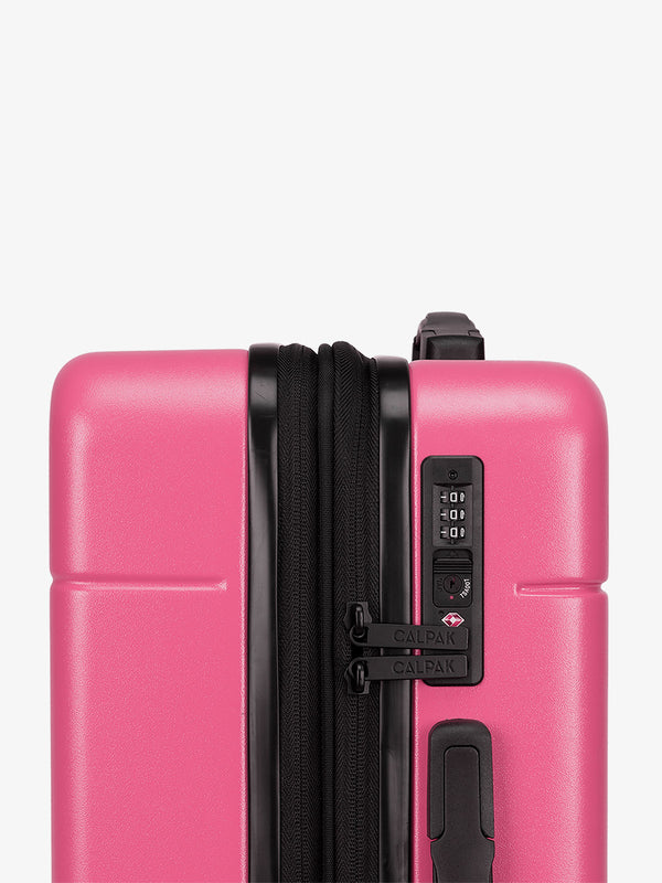 CALPAK Hot pink dragonfruit Hue rolling carry-on suitcase with TSA locks