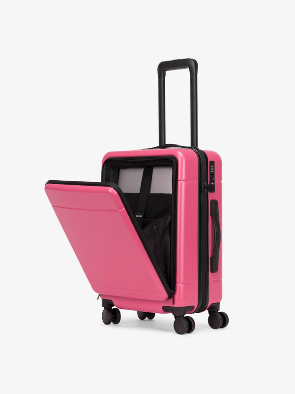 CALPAK Hue carry-on hard shell luggage with front pocket in hot pink dragonfruit