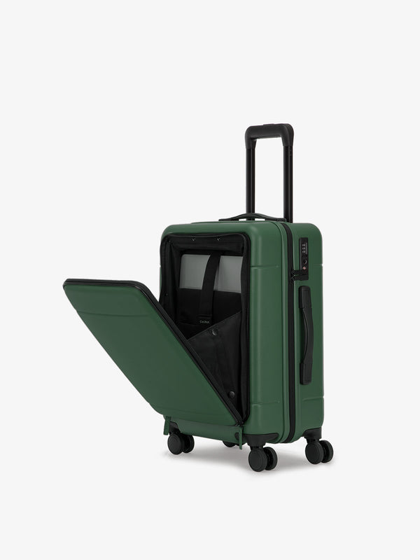 CALPAK Hue carry-on hard shell luggage with front pocket in emerald green