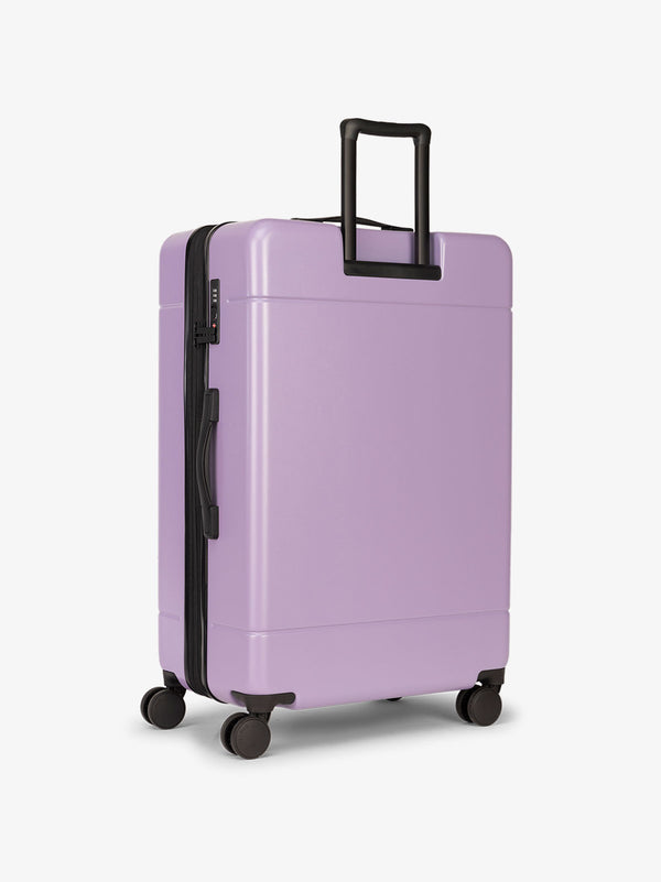 Hue large 28 inch durable hard shell polycarbonate luggage in purple