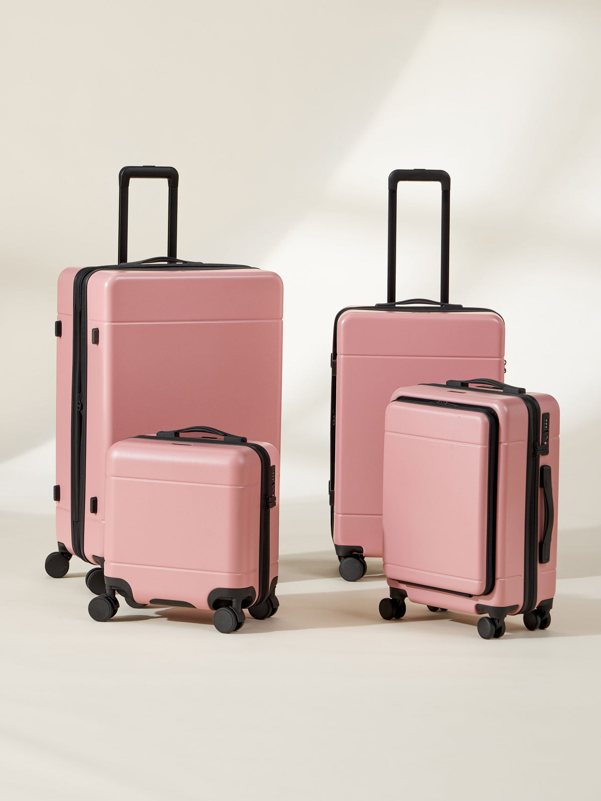 CALPAK Hue Full Luggage Set including Front Pocket Carry On, Mini Carry On, Carry On, and Large Luggage in blush pink mauve; LHU1014-MAUVE