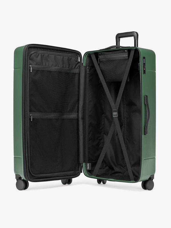 interior of CALPAK Hue Collection polycarbonate trunk luggage in green emerald