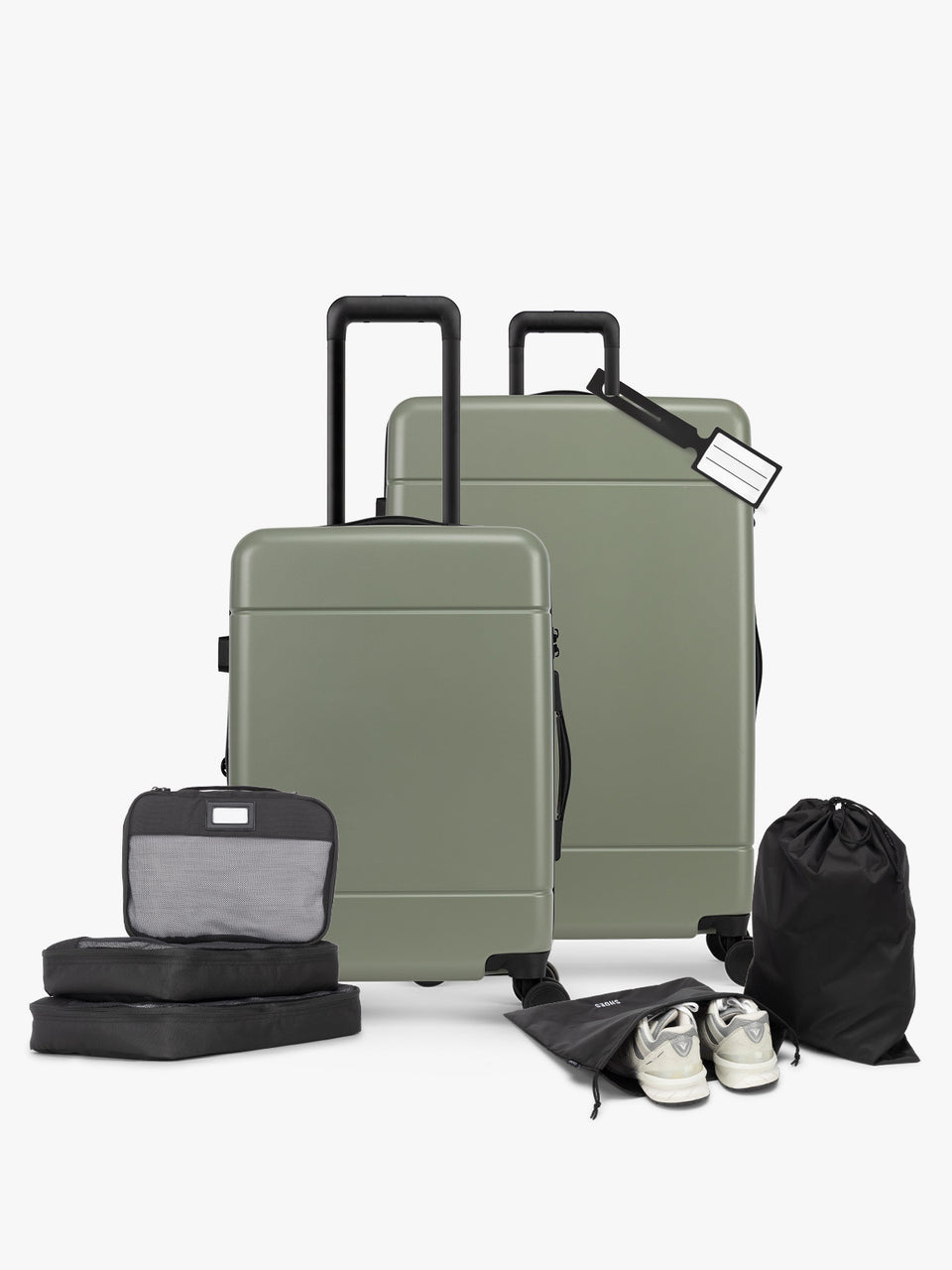 CALPAK Hue Starter Bundle in green Juniper that comes with Large and Carry On Luggage, Luggage Tag, Two Black Pouches, and Three Black Packing Cubes shown on a white background; LHU8000-JUNIPER