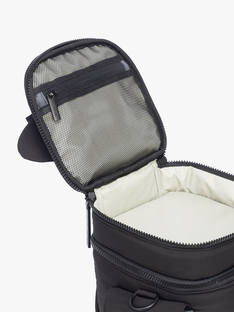 Opened and top mesh pocket shown in CALPAK Insulated Baby Bottle Bag in Black