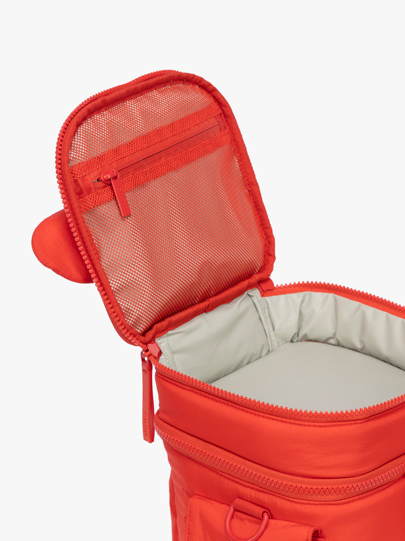 Opened top mesh compartment of CALPAK Insulated Baby Bottle Bag in red Tomato