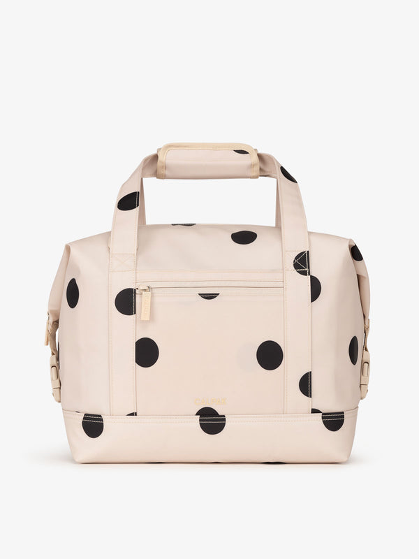 Black and white polka dot printed 17L insulated cooler bag with multiple exterior pockets and water-resistant lining