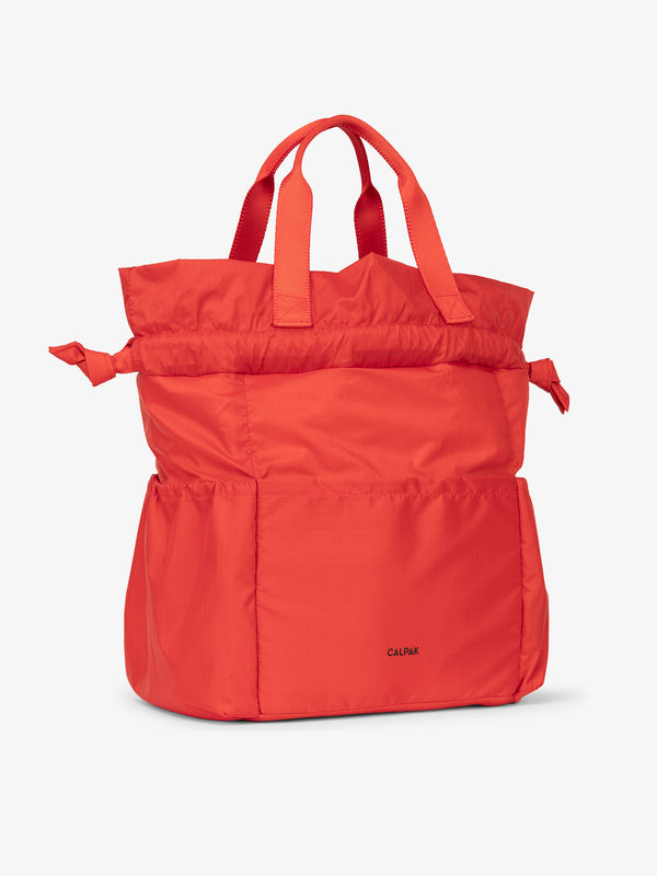 CALPAK Insulated Lunch Bag for men with multiple pockets and drawstring closure in rouge
