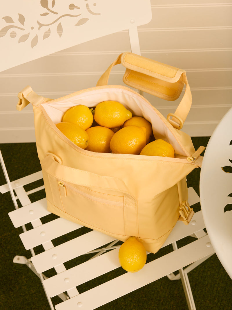 CALPAK Insulated 8L Soft Sided Cooler in yellow Lemonade filled with lemons