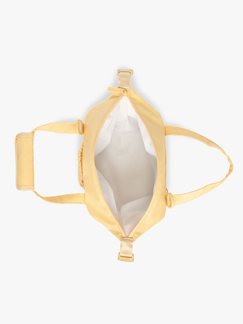 Interior of insulated 8L soft sided cooler bag by CALPAK in yellow Lemonade with white lining