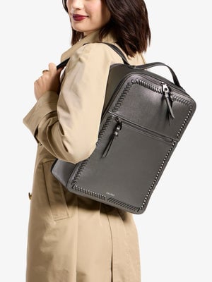 Model wearing metallic steel Kaya 15 inch Laptop Backpack; BP1702-SQ-STEEL