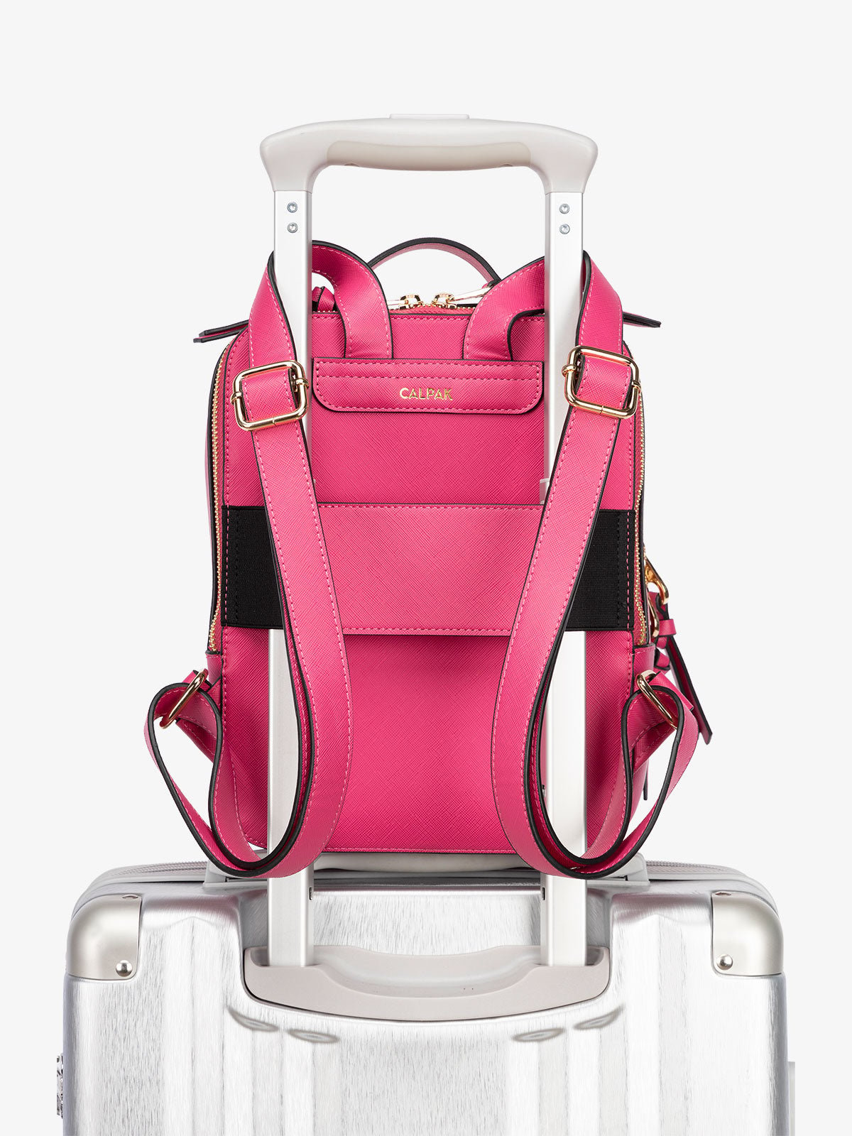 CALPAK Kaya Mini Backpack with luggage trolley and adjustable straps in pink