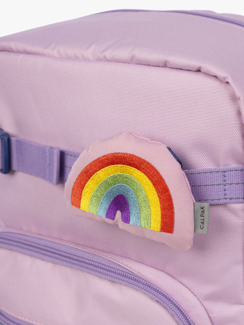 CALPAK Kids Collection Rainbow Pluffy Bag Charm attached to Kids Large pink lavender Backpack