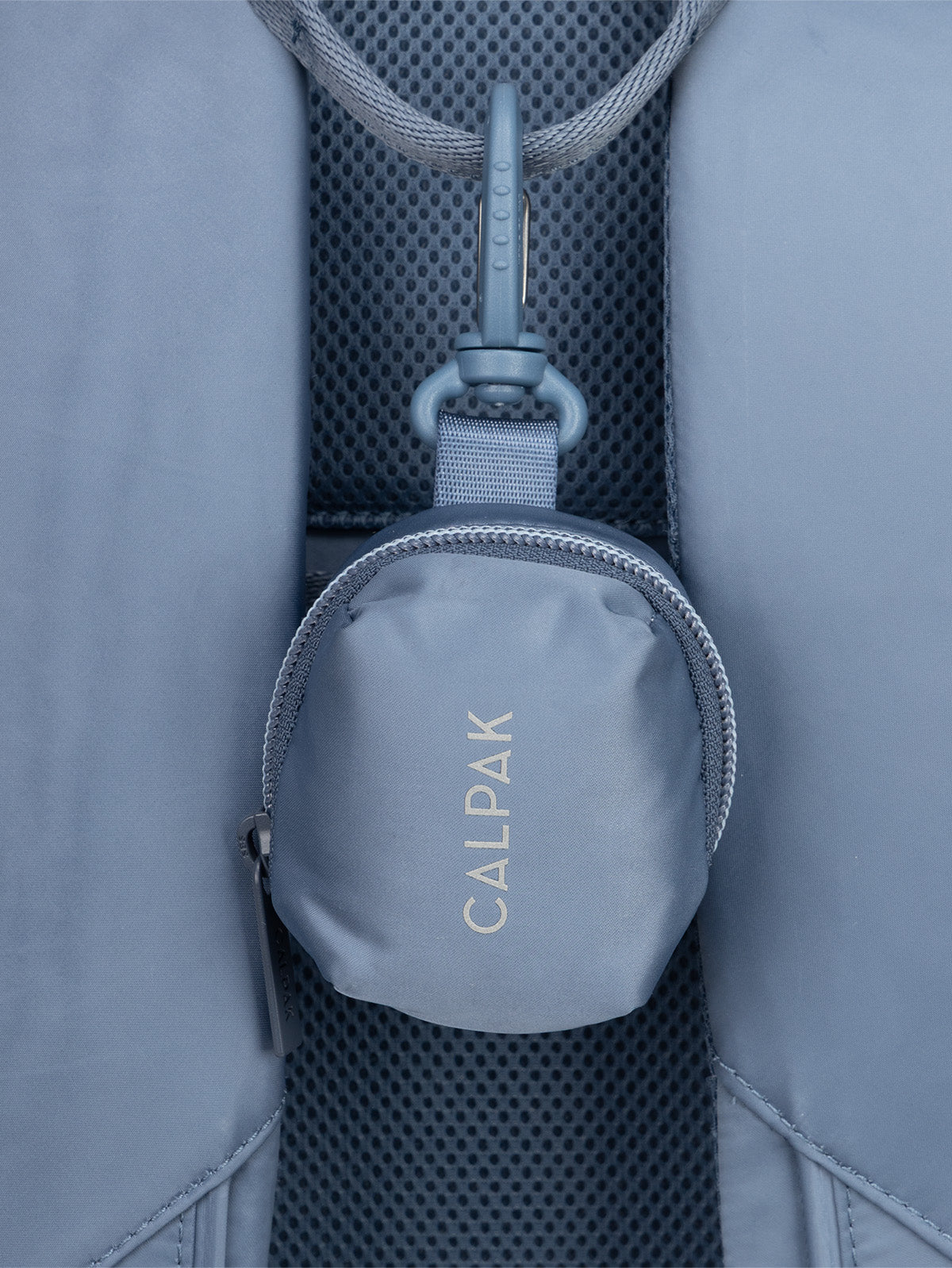 CALPAK Fit Zip Bag Charm in dark blue Indigo with hook and zipper hooked on bag; KPF2601-INDIGO