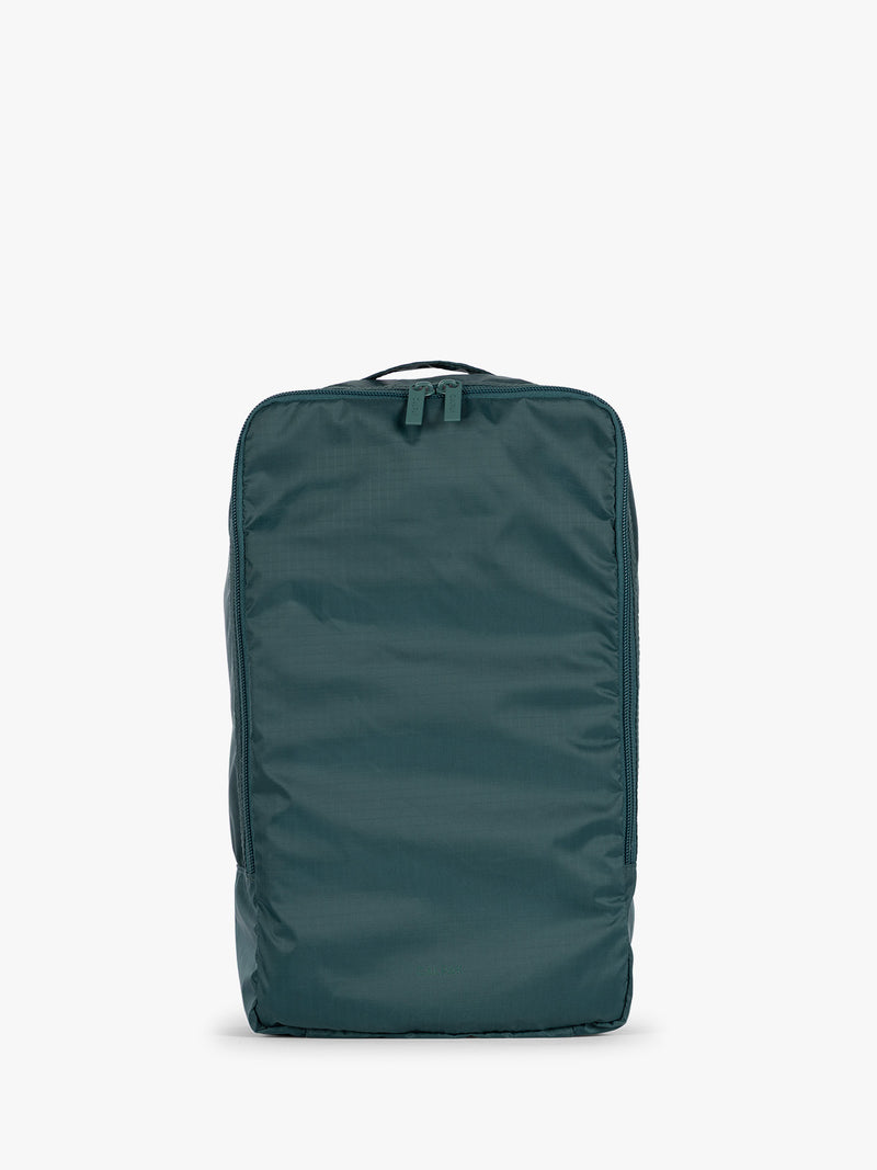 Dark green teal Kale rectangular CALPAK shoe cube with zippers and top handle shown on a plain background