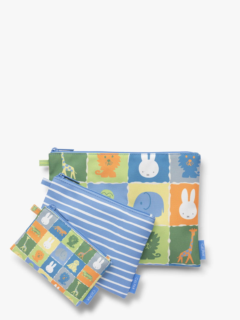 Set of blue, white, green, and yellow colorful children's pouches with Miffy and animal patterns for the CALPAK Compakt Zip Pouch Set on a white background
