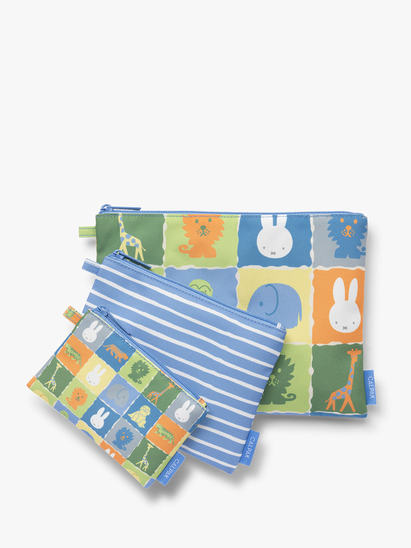 Set of blue, white, green, and yellow colorful children's pouches with Miffy and animal patterns for the CALPAK Compakt Zip Pouch Set on a white background