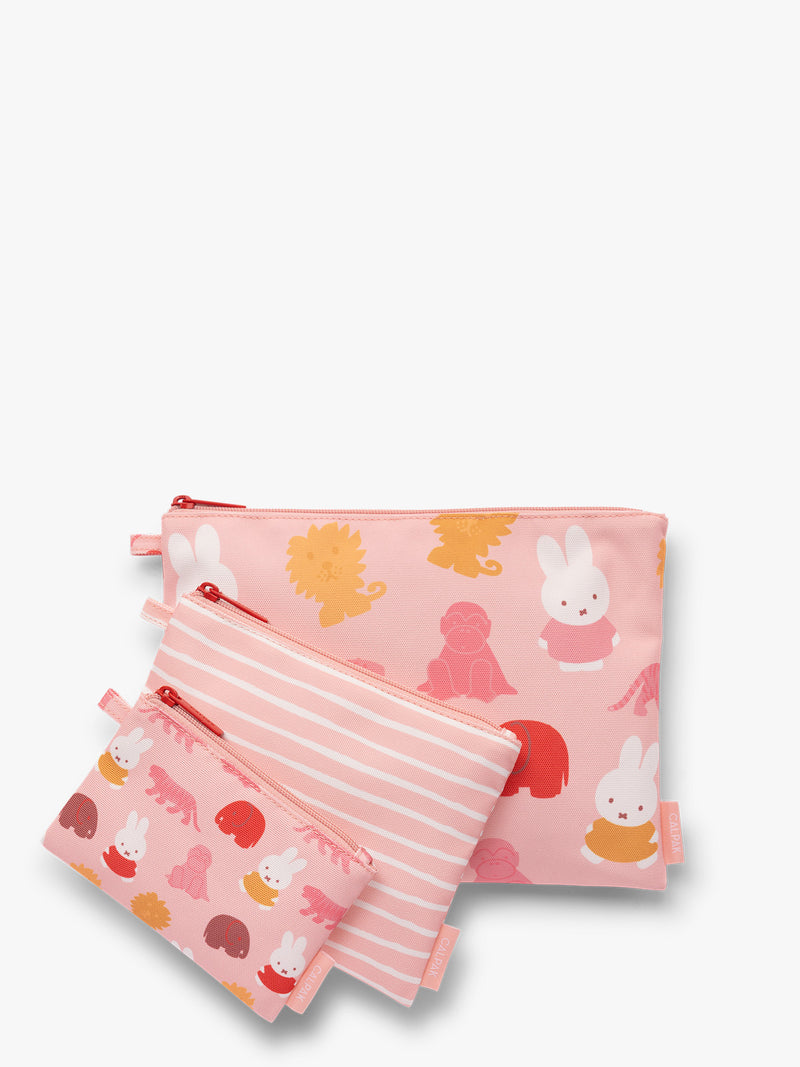 Set of pink and white colorful children's pouches with Miffy and animal patterns for the CALPAK Compakt Zip Pouch Set on a white background