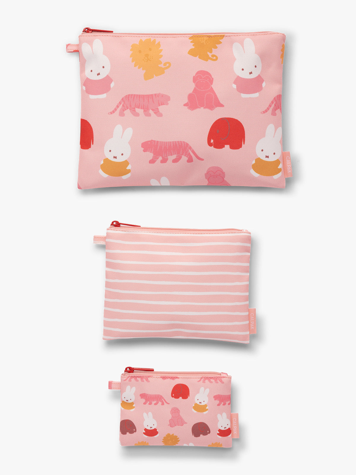 Flat-lay of set of blue, pink and white colorful children's pouches with Miffy and animal patterns for the CALPAK Compakt Zip Pouch Set on a white background; KZB2001-MIFFY-PINK-ZOO-TRIP