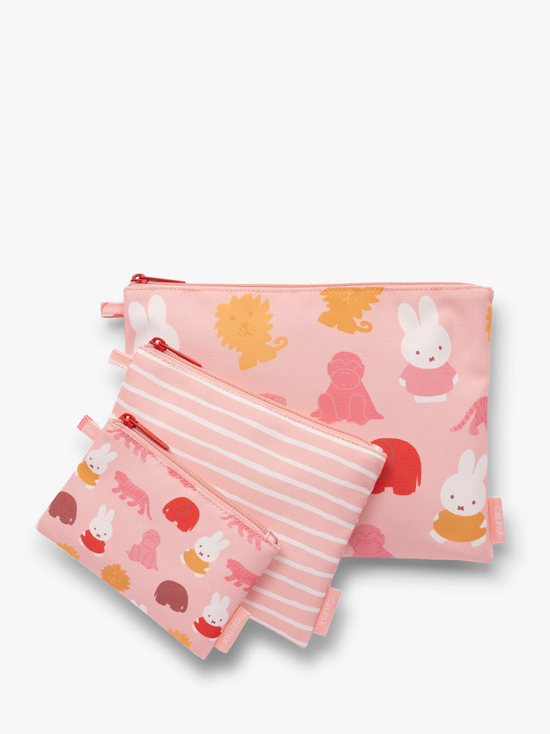 Set of pink and white colorful children's pouches with Miffy and animal patterns for the CALPAK Compakt Zip Pouch Set on a white background