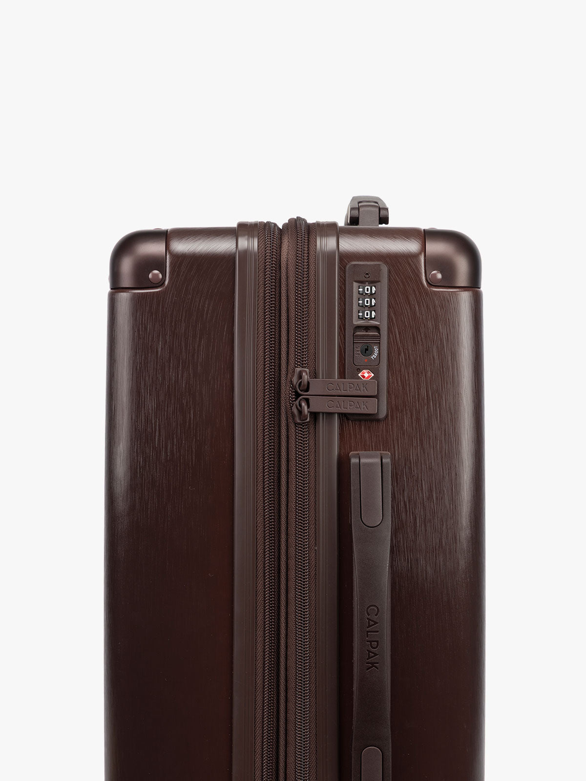 TSA lock of CALPAK Ambeur 2pc Set that includes Carry-On Luggage and Large Luggage in brown Walnut metallic look; LAM2000-WALNUT