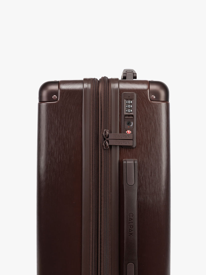 TSA lock of CALPAK Ambeur 2pc Set that includes Carry-On Luggage and Large Luggage in brown Walnut metallic look