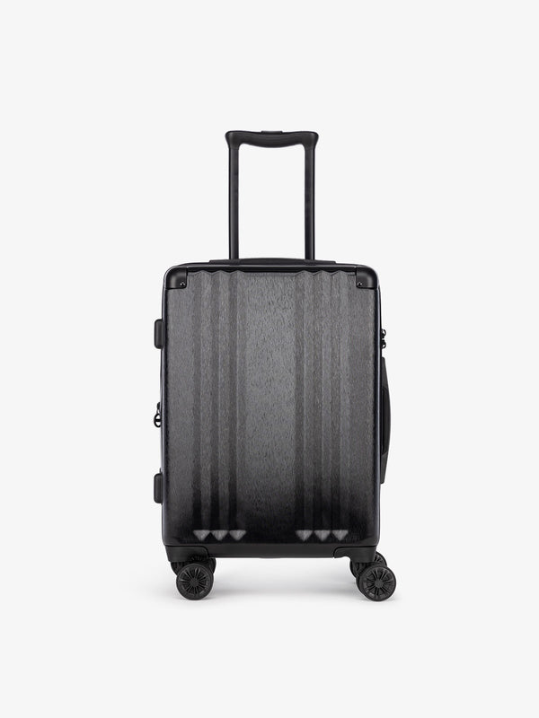 Studio product shot of front-facing CALPAK Ambeur black 22-inch rolling spinner carry-on luggage with TSA lock