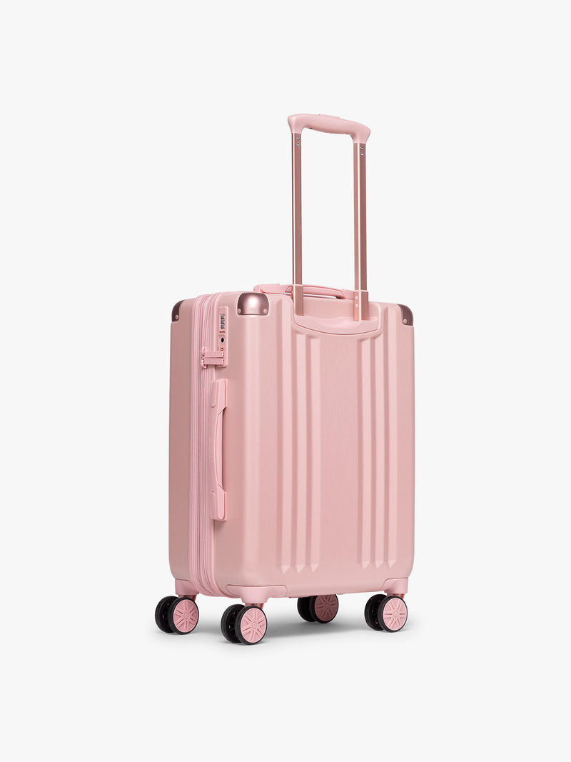 Back view of CALPAK Ambeur Carry-On Luggage in metallic pink Blossom with pink wheels