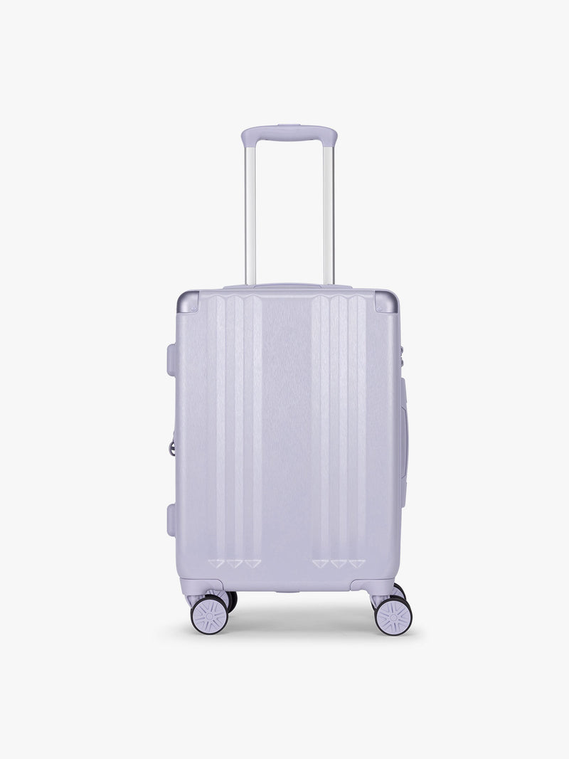 CALPAK Ambeur Carry On Luggage in light lavender in Sea Glass with handle and spinner wheels on a white background