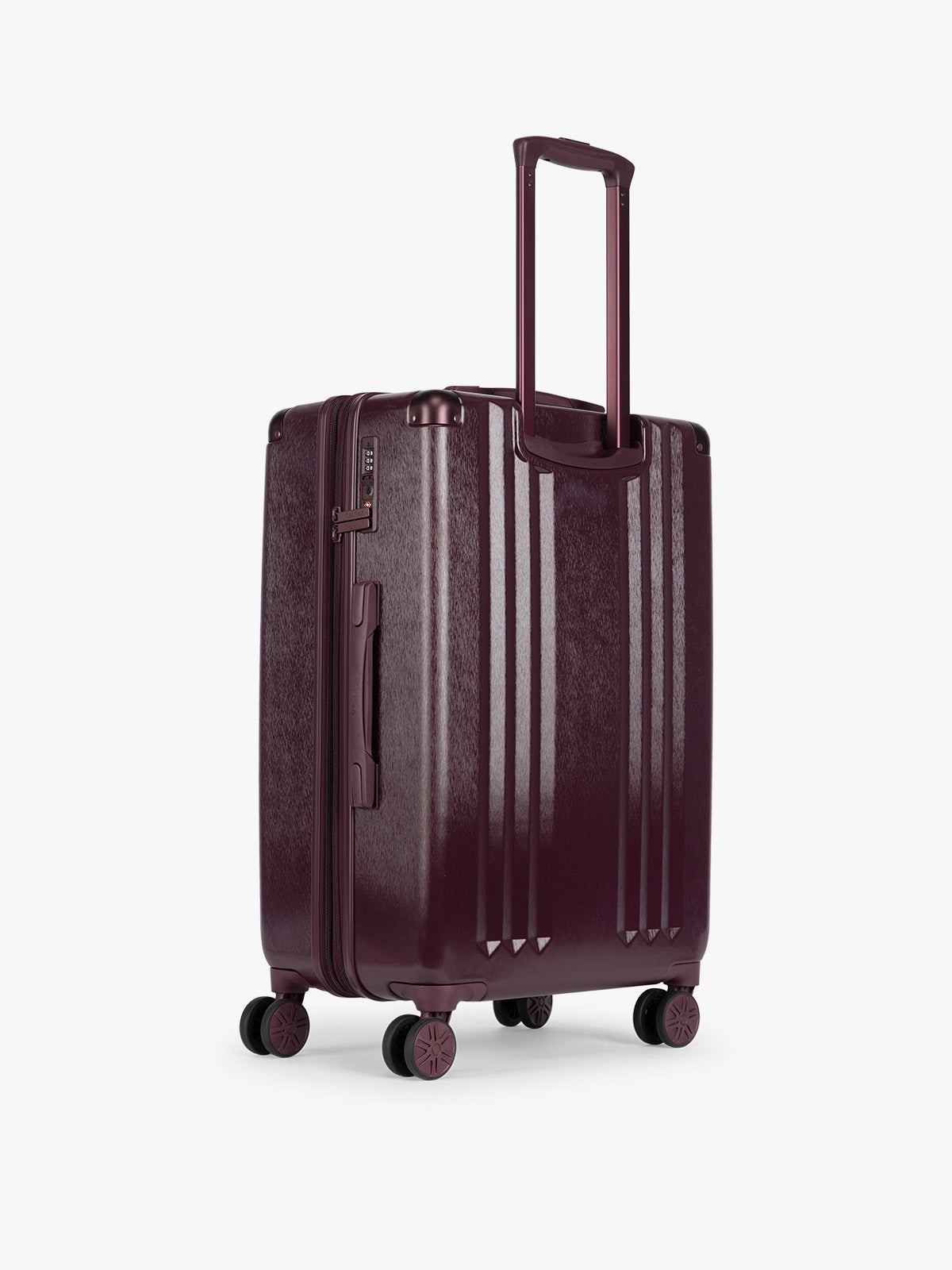 Back side of CALPAK Ambeur Medium Luggage in dark burgundy Dark Cherry with vertical ribbed detailing and an extended telescoping handle, shown from the front against a plain white background; LAM1024-DARK-CHERRY