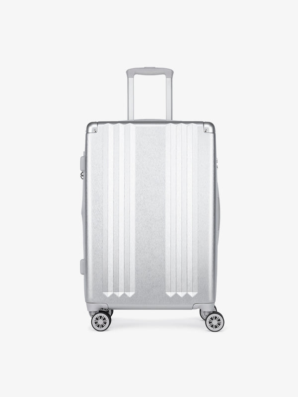 Studio product shot of front-facing CALPAK Ambeur silver medium 26-inch lightweight hardshell rolling luggage