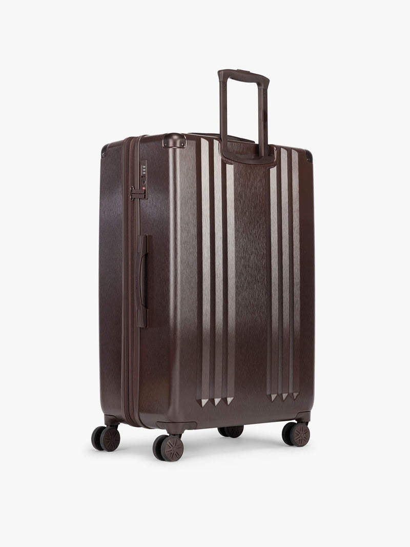 Backside of CALPAK Ambeur Large Luggage in brown Walnut with metallic look