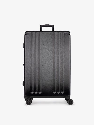 tudio product shot of front-facing CALPAK Ambeur large 30-inch black hardshell spinner luggage
