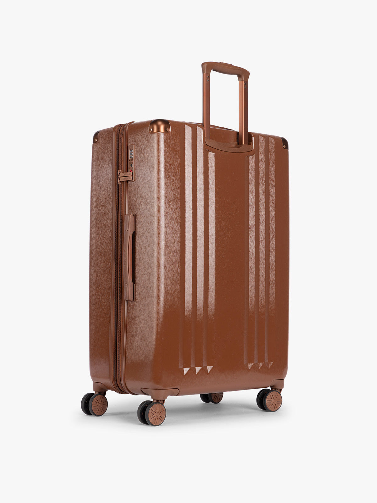 Back view of CALPAK Ambeur Large Luggage in light Honey Brown with vertical ribbed detailing and an extended telescoping handle, shown against a plain white background; LAM1028-HONEY-BROWN