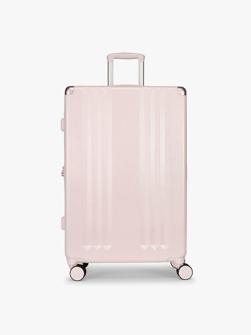 CALPAK Ambeur Large Luggage in light pink in Shell Pink with handles and spinner wheels