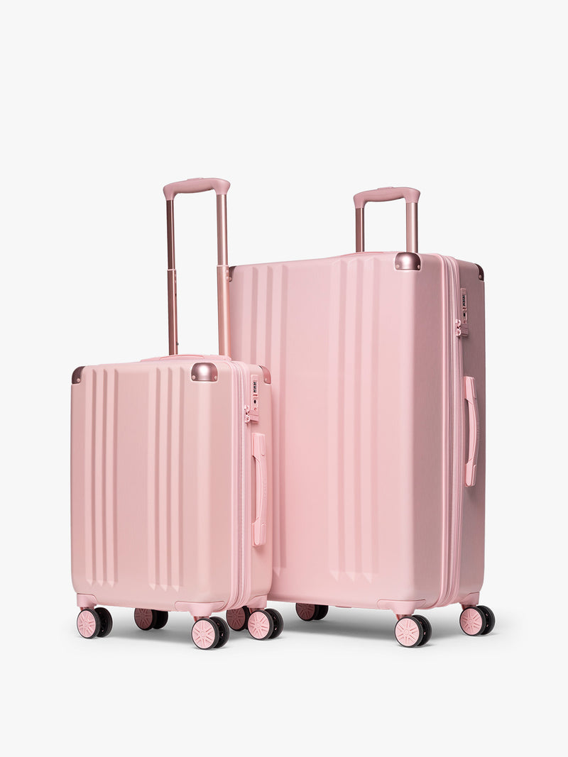 CALPAK 2pc Ambeur Luggage Set featuring the Ambeur Carry-On Luggage and Ambeur Large Luggage in metallic pink Blossom with pink wheels