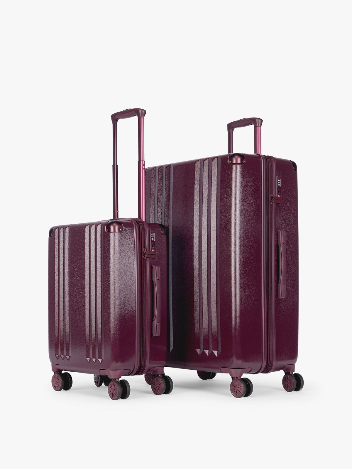 CALPAK Two-Piece Set in dark burgundy Dark Cherry which includes the Carry On and Large sizes with vertical ridges, shown on a clean white background; LAM2000-DARK-CHERRY